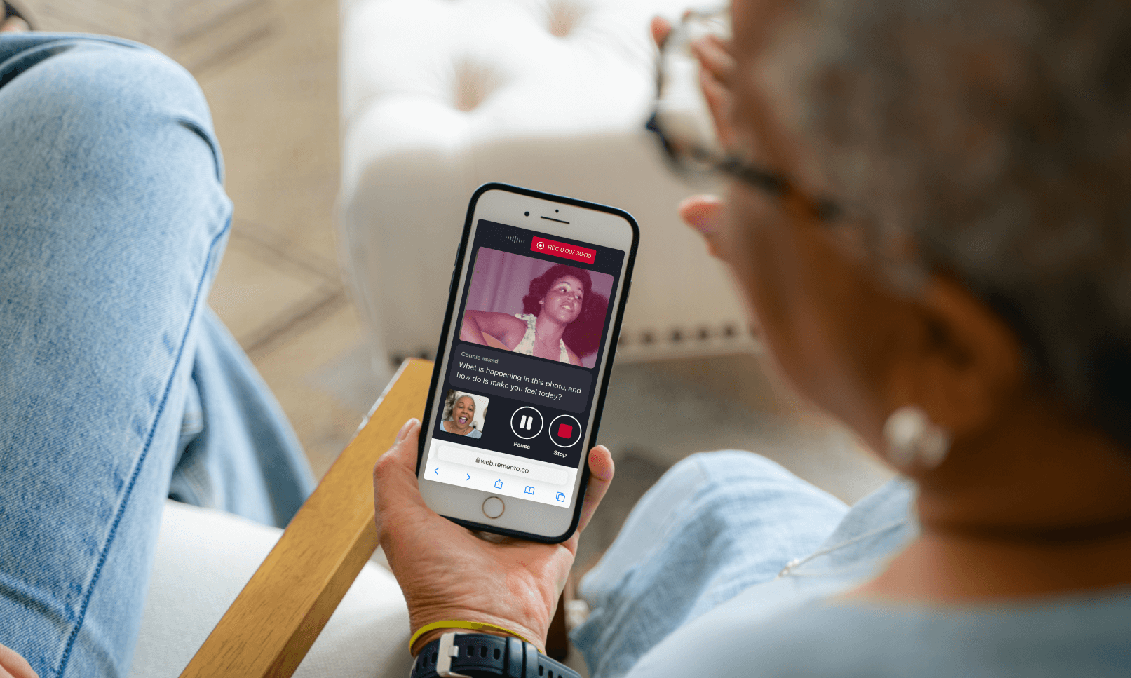 A person is holding a phone and recording themselves on Remento
