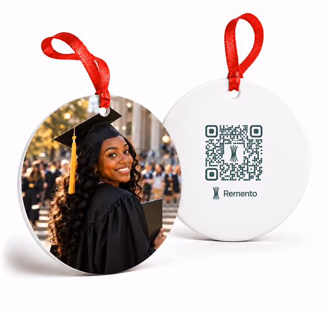 Graduate in cap and gown on a graduation photo ornament, shown with its QR code back