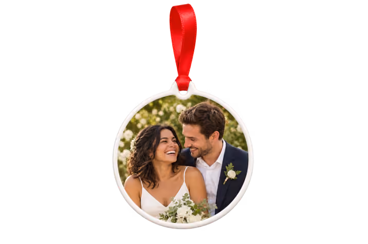 Ceramic first Christmas married photo ornament with red ribbon showing a bride and groom