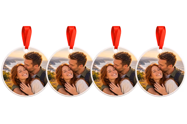 Four matching engagement photo ornaments with red ribbons, a Christmas ornament bundle