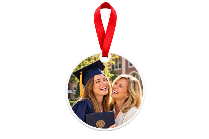 Ceramic graduation photo ornament with red ribbon showing a graduate and her mom